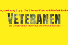 Ein Plakat mit der Aufschrift VETERANEN - Ein Gespräch mit Menschen aus der Bundeswehr mit Angabe des Termins.
