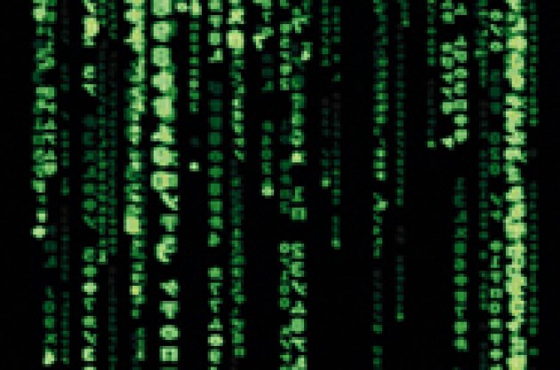 Bildschirmschoner mit grünen Symbolen auf schwarzem Grund im Stil der Filme der \"Matrix"-Reihe