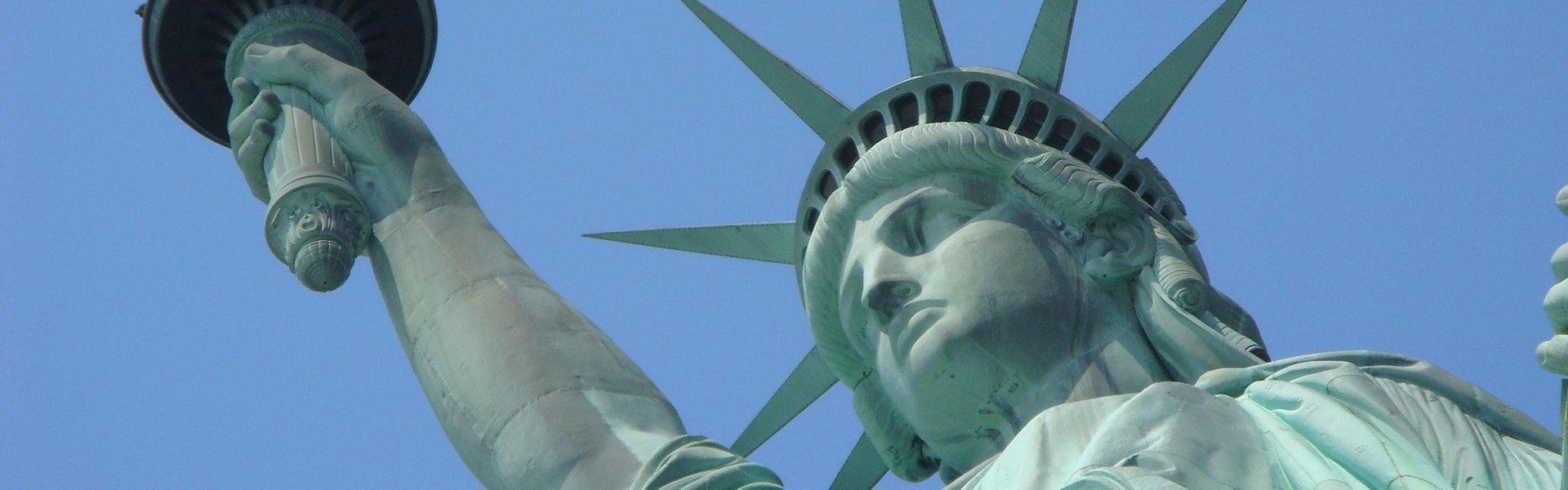 Ausschnitt eines Fotos, das die Freiheitsstatue in New York zeigt